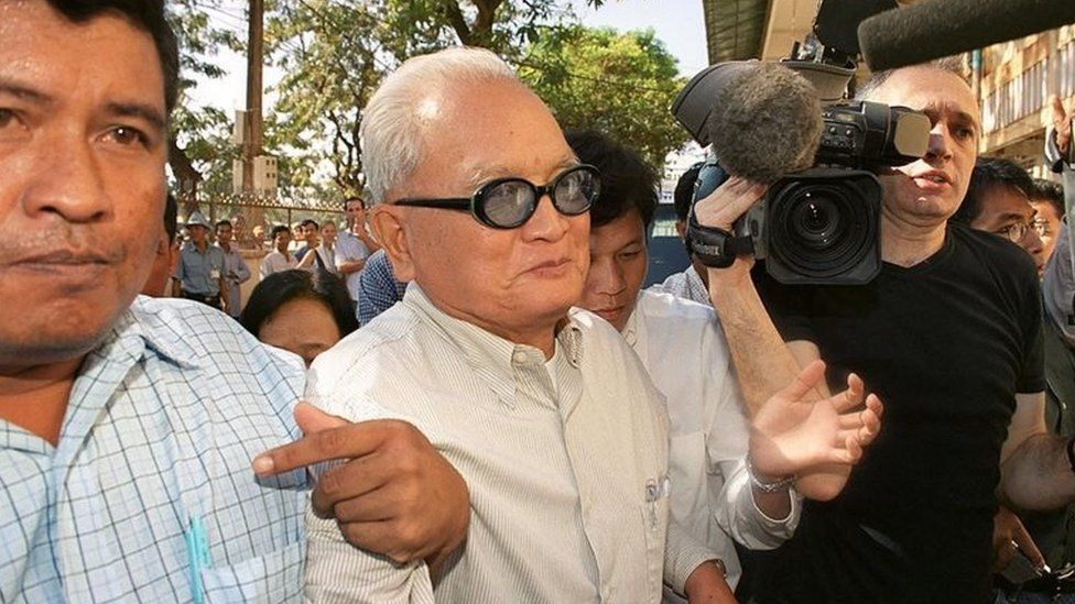 Nuon Chea arrives at court in 2002 to testify in a case relating to the deaths of three Western backpackers killed in 1994 by the Khmer Rouge