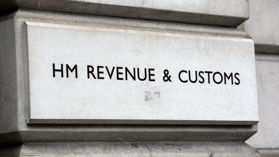HMRC sign on stone wall