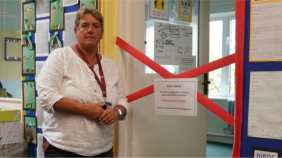 Caroline Evans, head teacher of Parks Primary School in Leicester stands next to a taped off section inside the school which contains RAAC