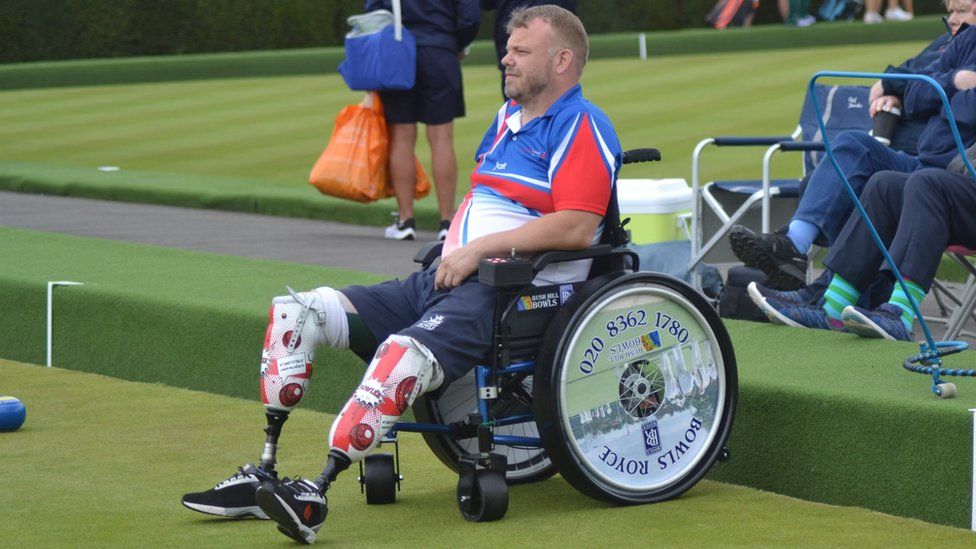 Craig Bowler in a wheelchair playing bowls
