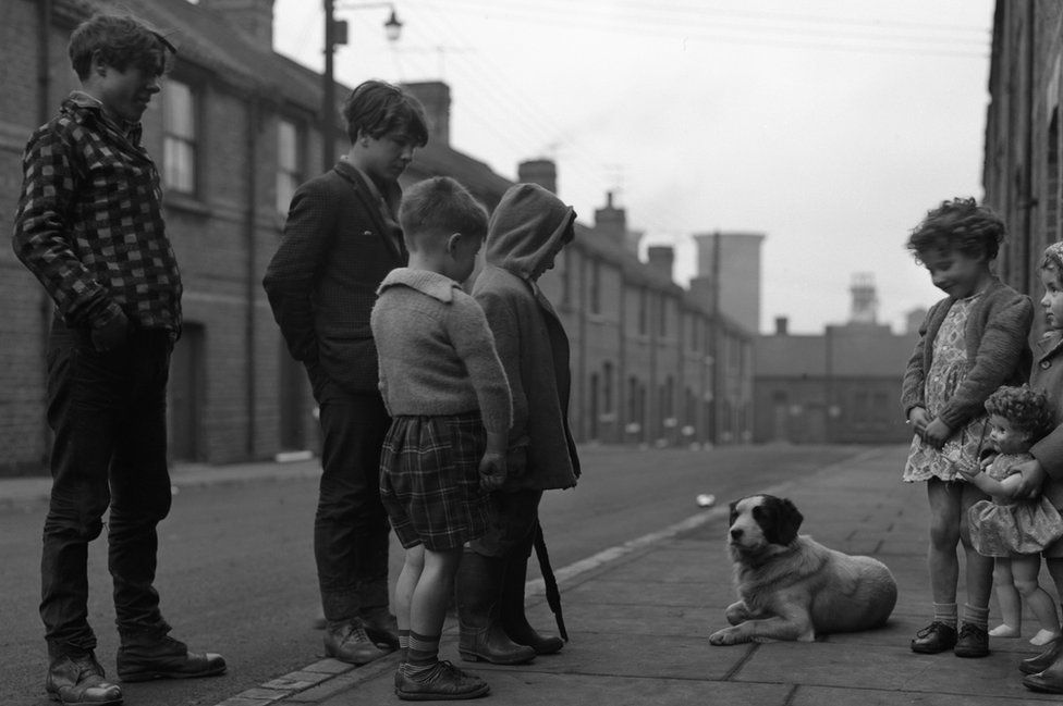 Children and a dog on a street in Middlesbrough in 1964