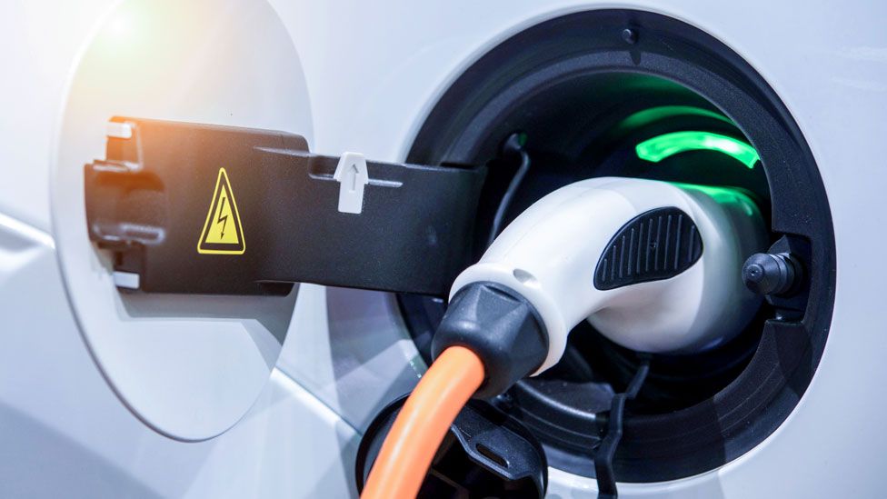 Stock image of an electric car being charged
