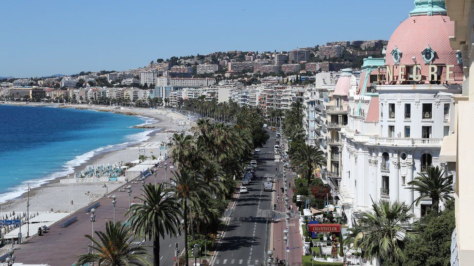 This picture taken on July 15, 2016, shows the site where a truck drove into a crowd watching a fireworks display on the Promenade des Anglais seafront near the Negresco Hotel in the French Riviera town of Nice on 15 July 2016.