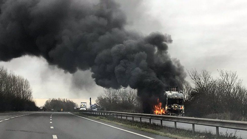 The fire created a large plume of black smoke that could be seen for miles.