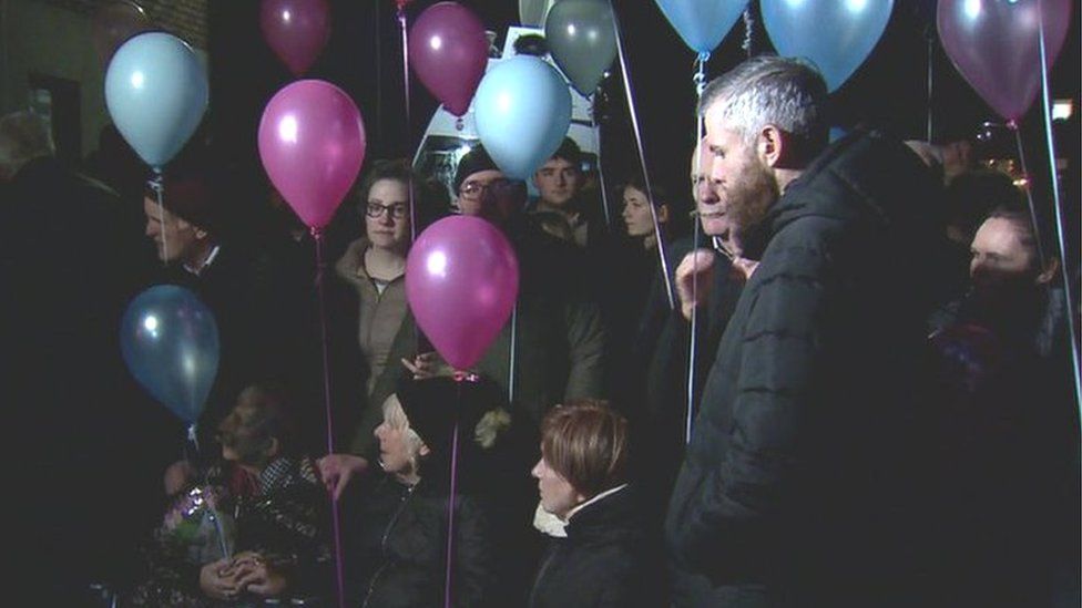 Pink and blue balloons were released into the air in memory of the expectant mother