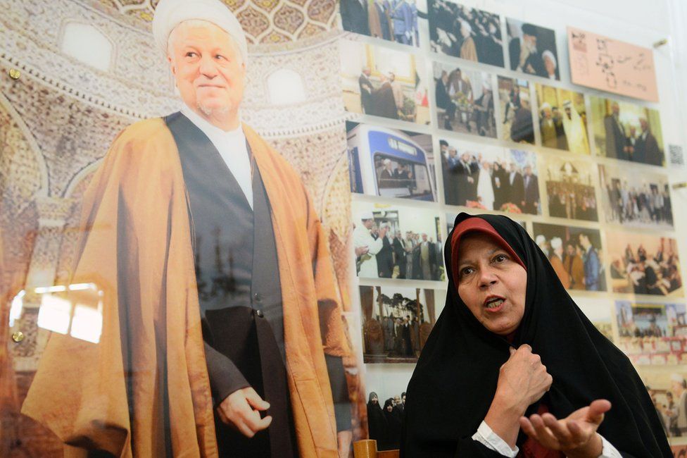 File photo showing Faezeh Hashemi speaking next to a photo of her father, Akbar Hashemi Rafsanjani (11 January 2019)
