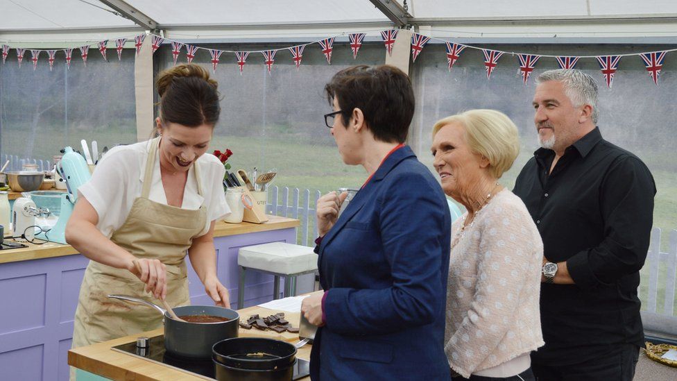 Contestants and judges in Bake Off tent