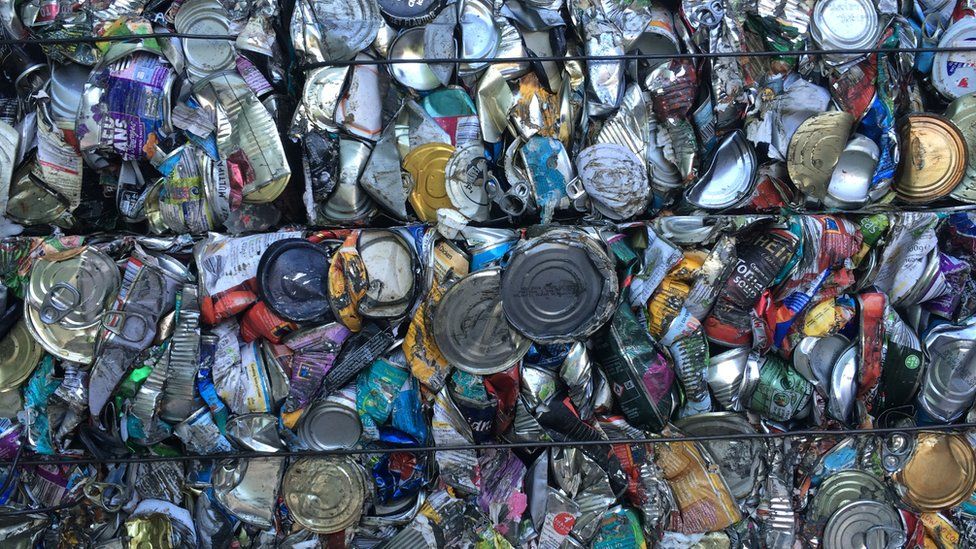 Crushed tins baled to sell