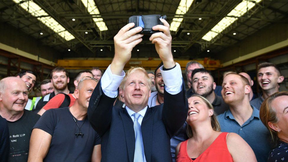 Boris Johnson using a mobile phone to take a selfie