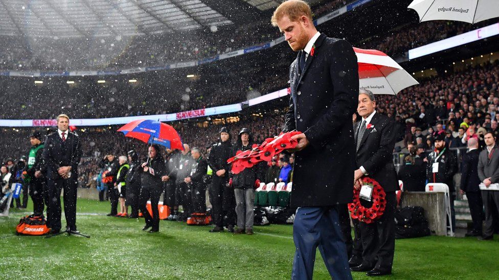 Prince Harry, Duke of Sussex, walks to lay a wreath on the pitch ahead of the autumn international rugby union match between England and New Zealand