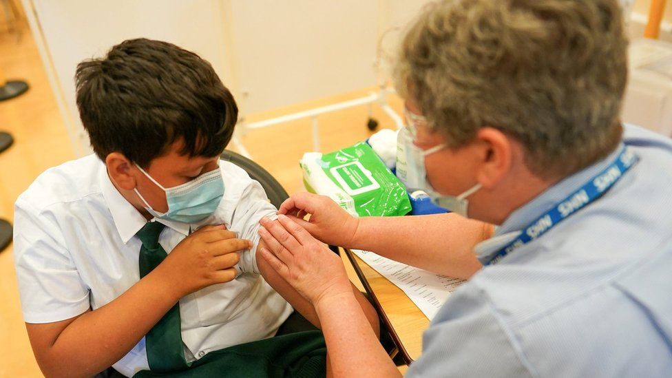 Boy, 13, receives a Covid vaccine