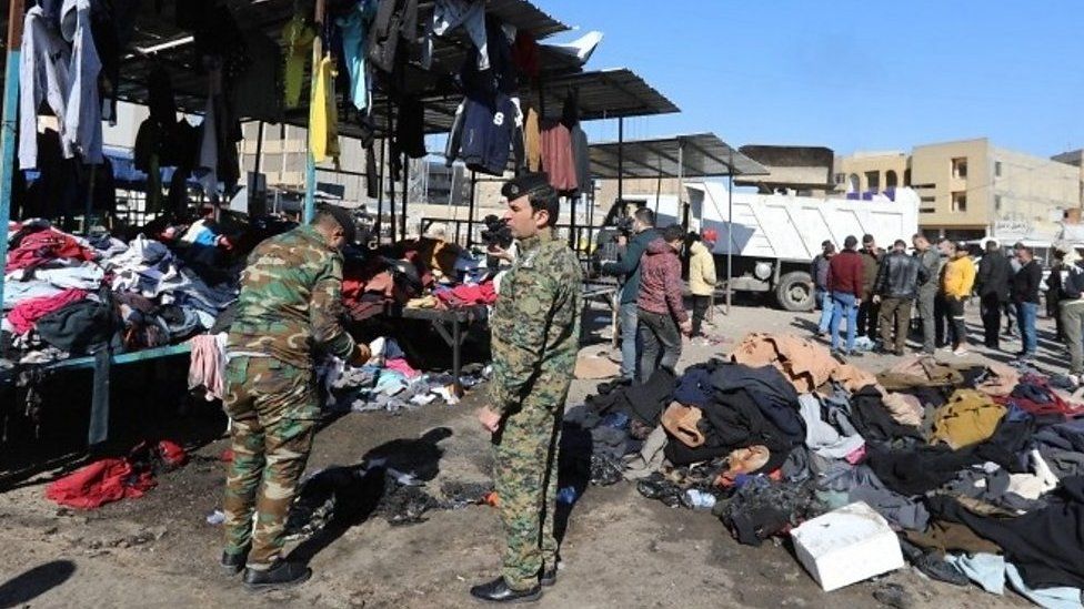 Aftermath of twin suicide bombing at market in Baghdad, Iraq