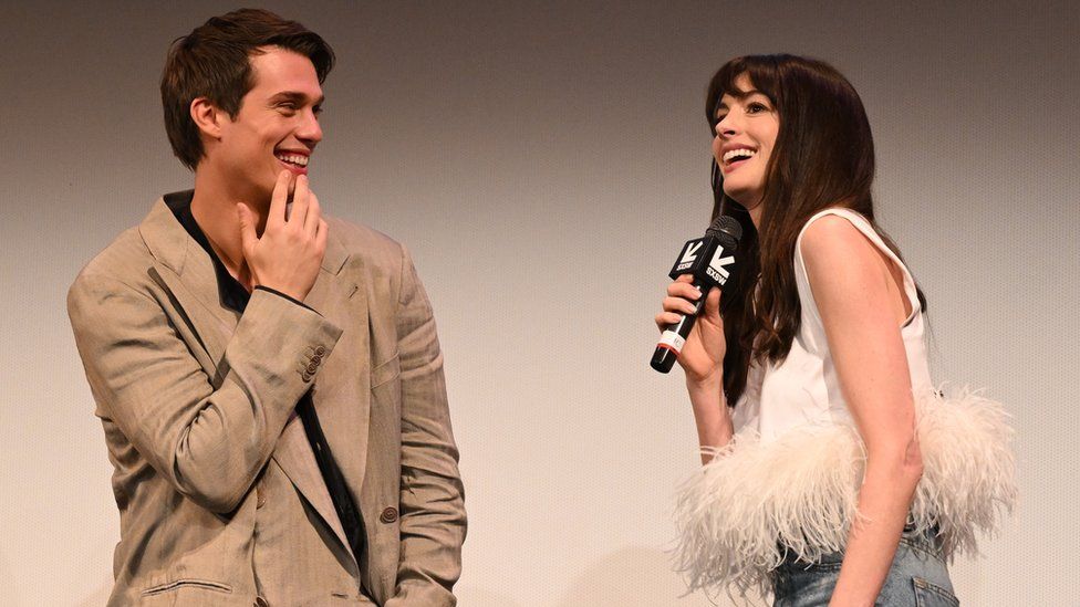 Nicholas Galitzine and Anne Hathaway speak onstage at "The Idea Of You" World Premiere during SXSW at The Paramount Theater on March 16, 2024 in Austin, Texas.