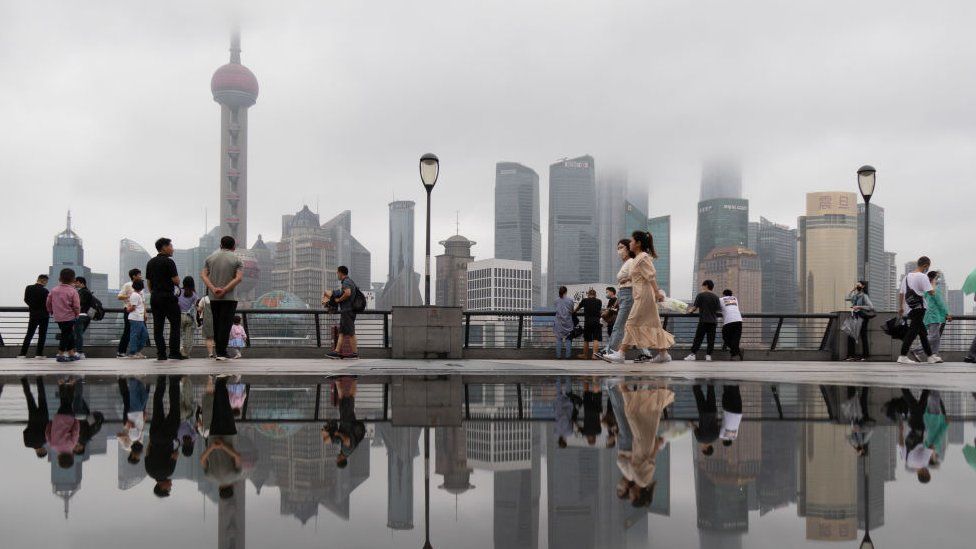 Tourists in Shanghai ahead of the storm
