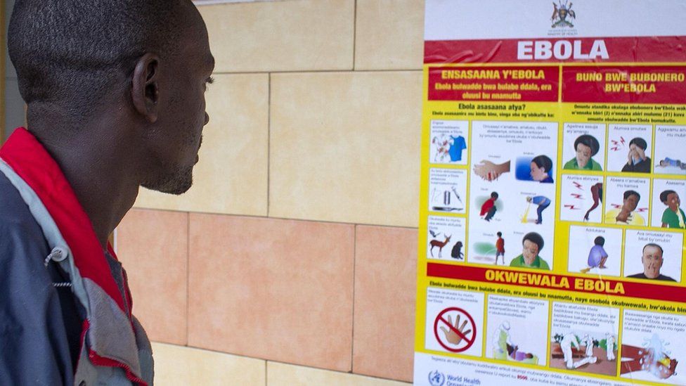 Someone in Uganda looking at an Ebola poster
