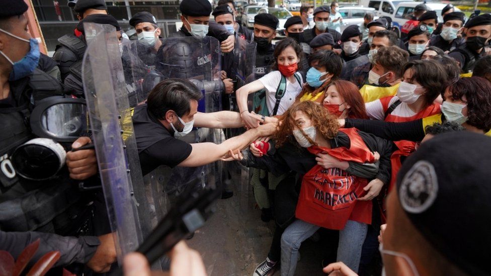 Turkish riot police officers scuffle with demonstrators