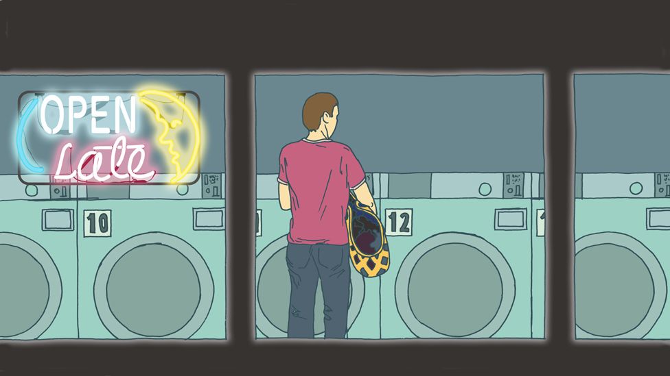 man in laundromat at night