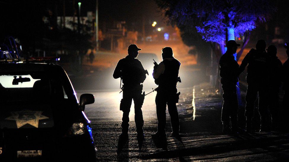 This file photo taken on February 07, 2017 shows members of the Mexican Army and Federal police patrol in a crime scene after an organized crime shooting at the Villa Juarez neighbourhood in Navolato, State of Sinaloa, Mexico.