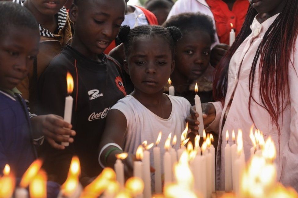 Children light candles during an event to pray and remember those who have lost their lives due to HIV/Aids, during World AIDS Day in Kariobangi, Nairobi, Kenya on 1 December 2019
