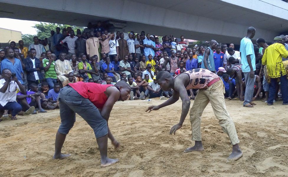 Men about to wrestle in front of a crowd - Sunday 14 April 2019