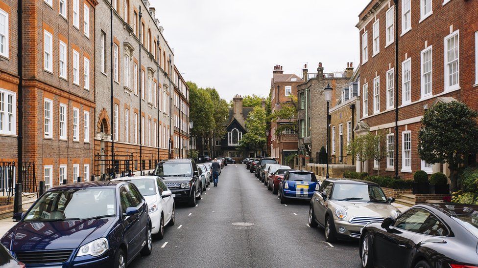 Street with parked cars in Kensington and Chelsea, London
