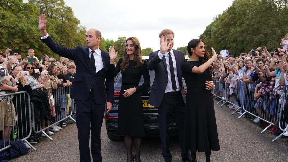 The Prince and Princess of Wales, and the Duke and Duchess of Sussex wave at mourners outside Windsor Castle following the Queen's death
