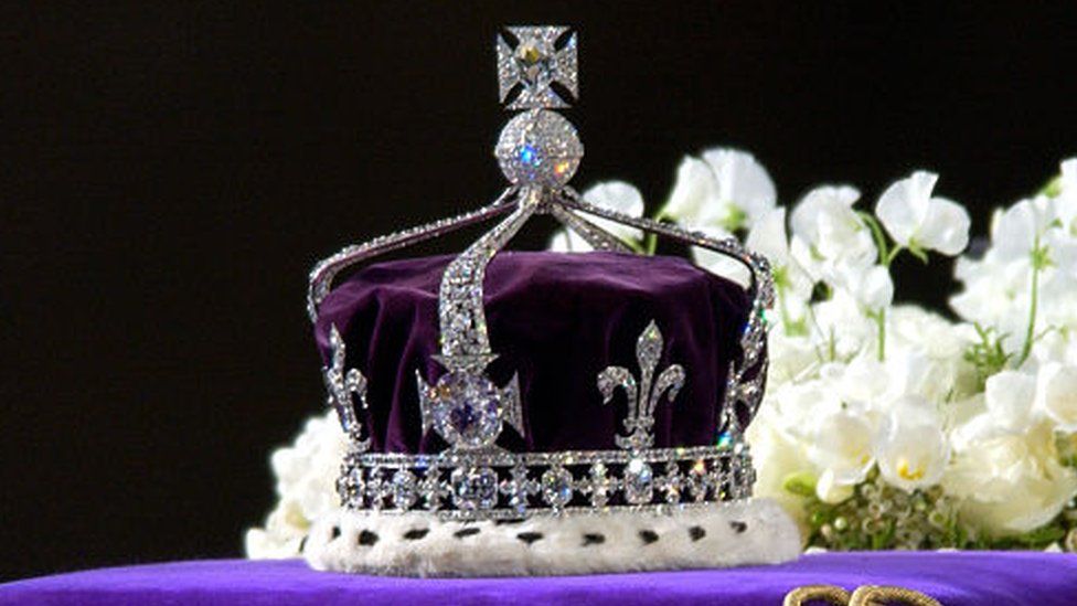 The coronation crown of the Queen Mother sits on top of her coffin.