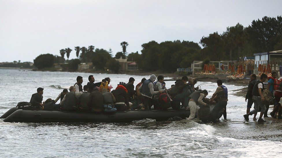 A dingy filled with migrants arriving in Kos in 2015