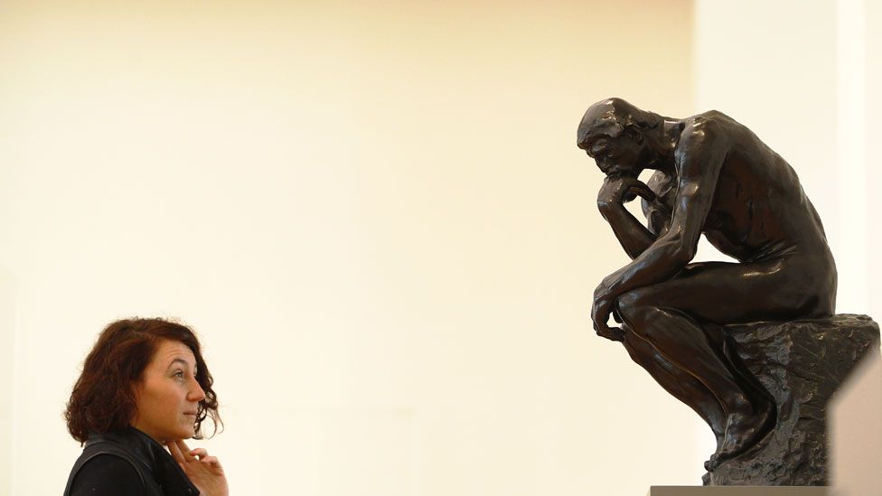 Visitor looks at of the Sculpture of Auguste Rodin, The Thinker, during a press preview in the Barberini Museum on January 19, 2017 in Potsdam, Germany