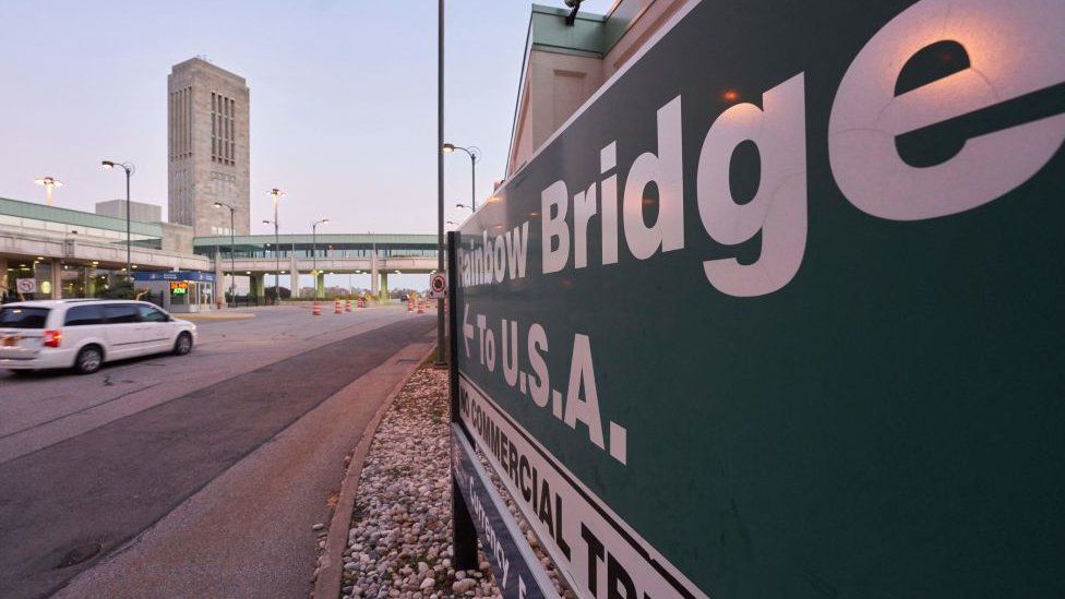 A vehicle prepares to cross the Rainbow Bridge in Niagara Falls, Ontario, on November 7, 2021.