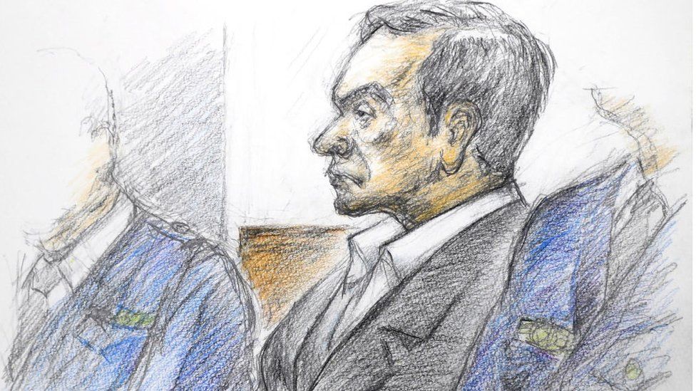 This courtroom sketch illustrated by Masato Yamashita depicts former Nissan chairman Carlos Ghosn attending his hearing at the Tokyo district court on January 8, 2019