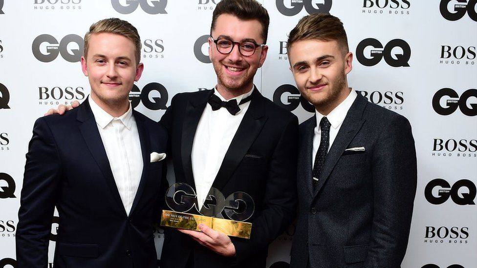 Guy and Howard Lawrence present Sam Smith with the Ciroc Solo Artist Award at the 2015 GQ Men of the Year Awards