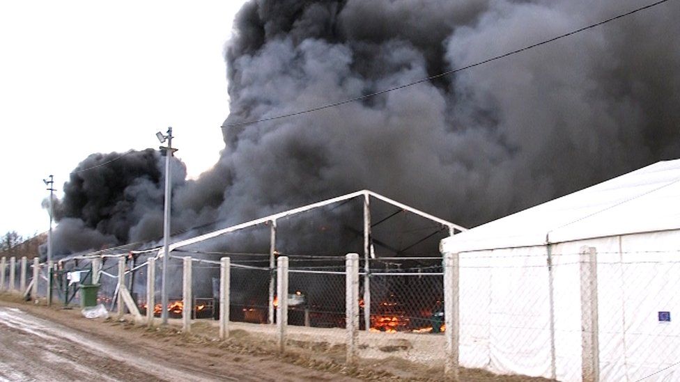 The Lipa migrant camp is seen under fire in Bihac, Bosnia and Herzegovina