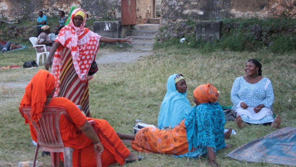Women sharing stories in Zanzibar