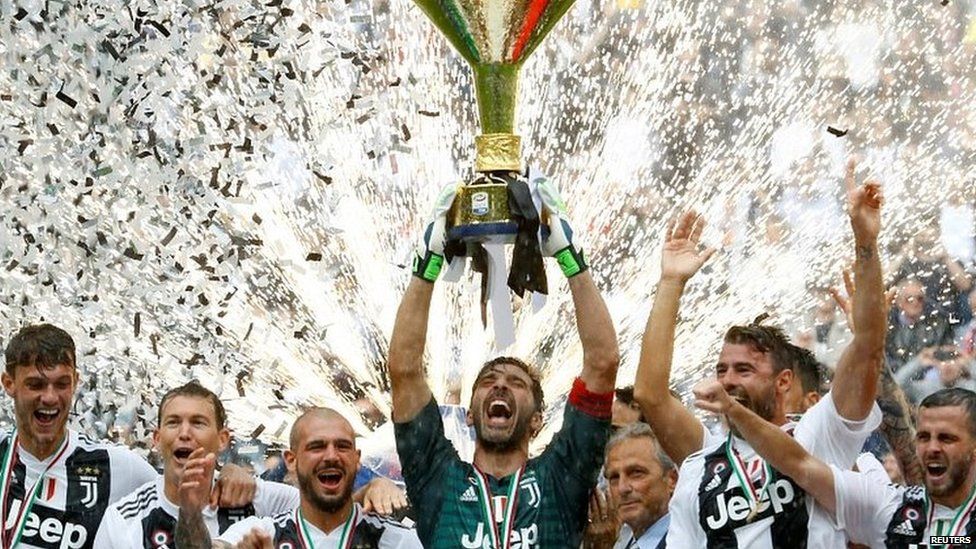 Juventus captain Gianluigi Buffon lifts the Italian champions trophy