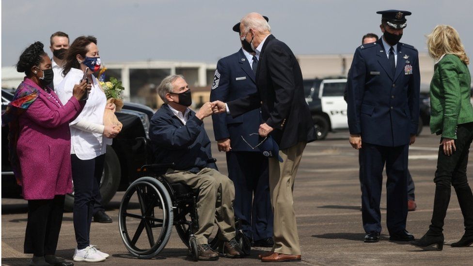 President Biden gave Republican Governor Greg Abbott a fist-bump after he landed in Houston