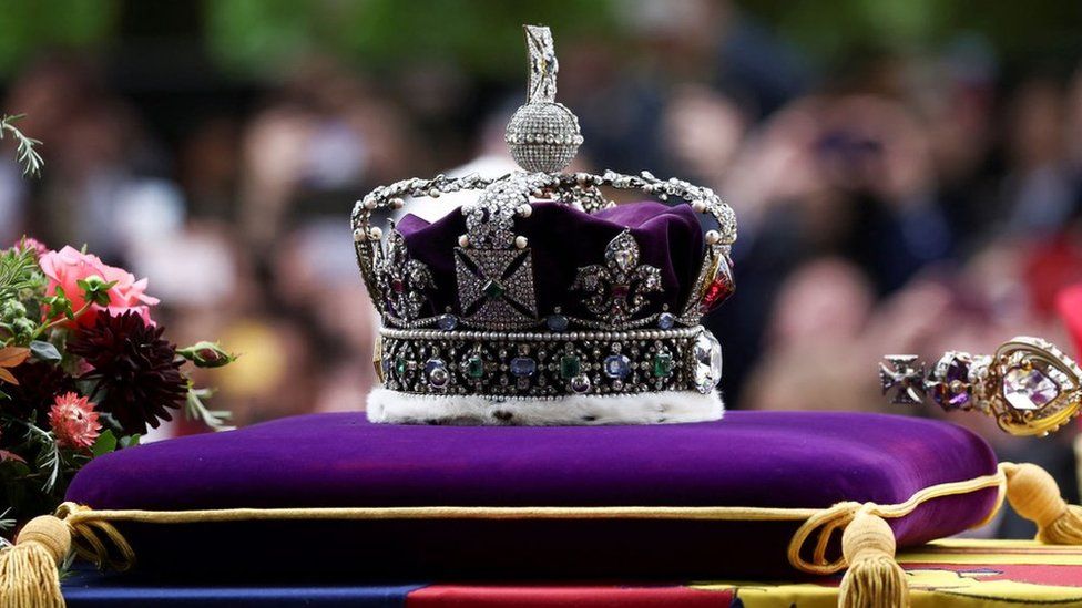 The royal crown is seen as the procession carries the coffin on the day of the state funeral and burial of Britain's Queen Elizabeth, in London