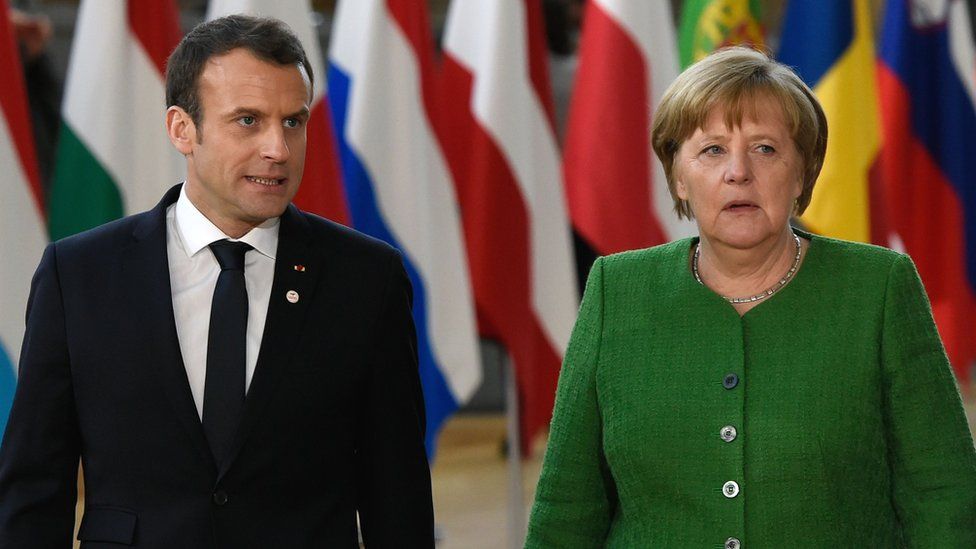 France's President Emmanuel Macron and Germany's Chancellor Angela Merkel arrive for an informal meeting of the 27 EU heads of state in Brussels, 23 February 2018