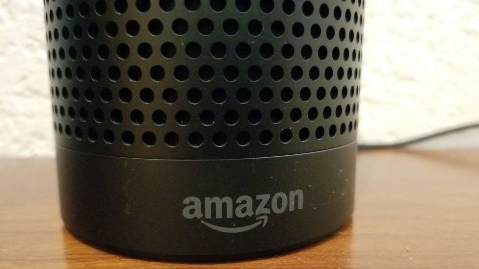 Close-up of the base of an Amazon Echo smart speaker using the Alexa service