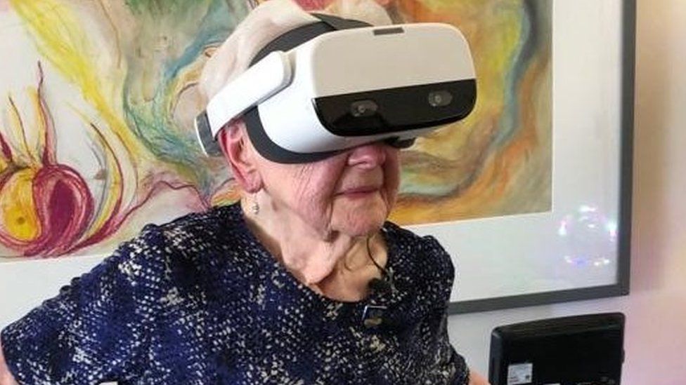 Joyce Penfold wearing the virtual reality headset