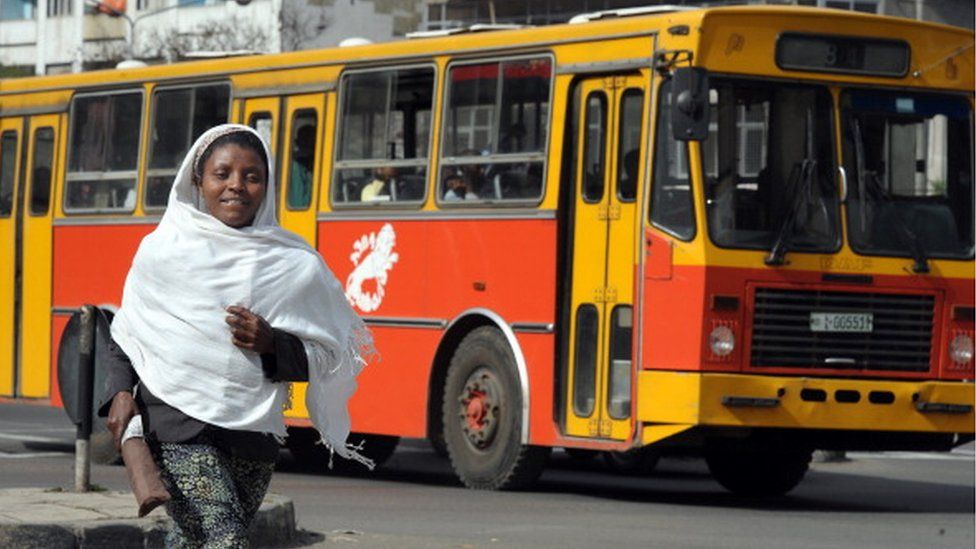 A woman runs in the streets of Addis Ababa