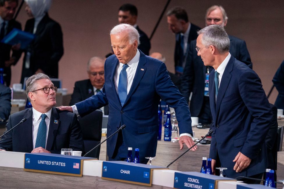 US President Joe Biden stands between Nato secretary general Jens Stoltenberg and UK prime minister Keir Starmer at the Nato anniversary summit in Washington