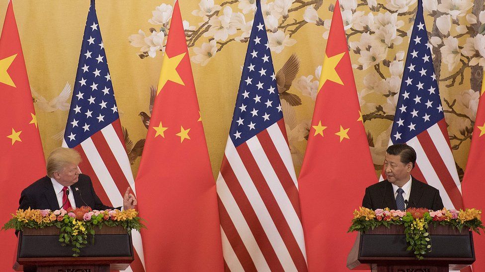 US President Donald Trump and Chinese President Xi Jinping speak during a joint statement in Beijing on November 9, 2017.