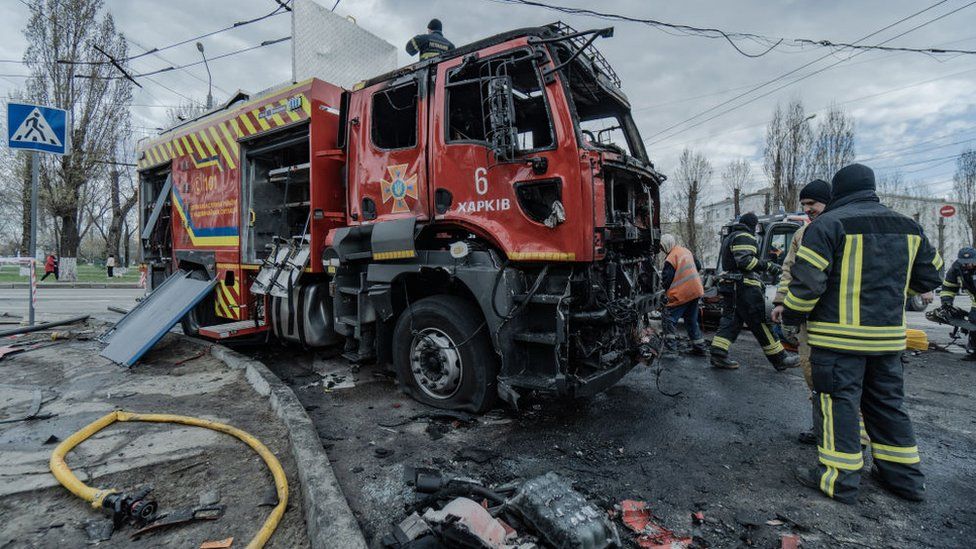 Firefighters inspect damaged fire truck after a Russian drone attack on April 4, 2024 in Kharkiv, Ukraine