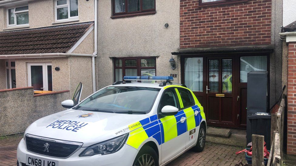 police car outside house on Leach Road in Bettws
