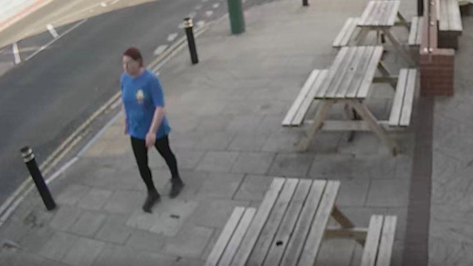Danielle Best captured on CCTV walking past picnic tables outside a pub