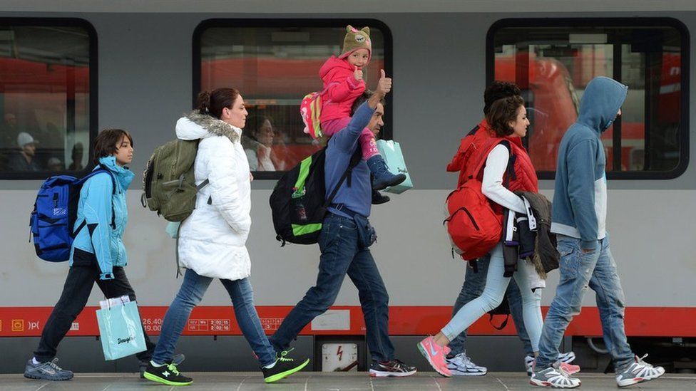 Migrants arrive in Munich in September 2016