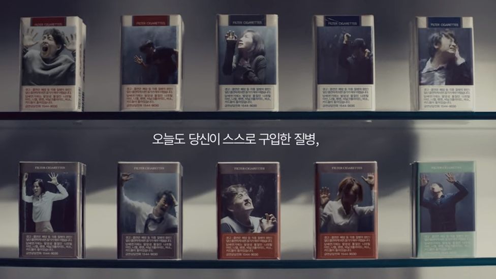 A still from the advert showing people trapped inside cigarette packets