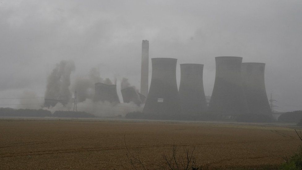 Smoke rising in the air as four towers are demolished