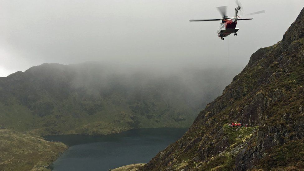 Search and rescue teams recover a man's body from Cader Idris